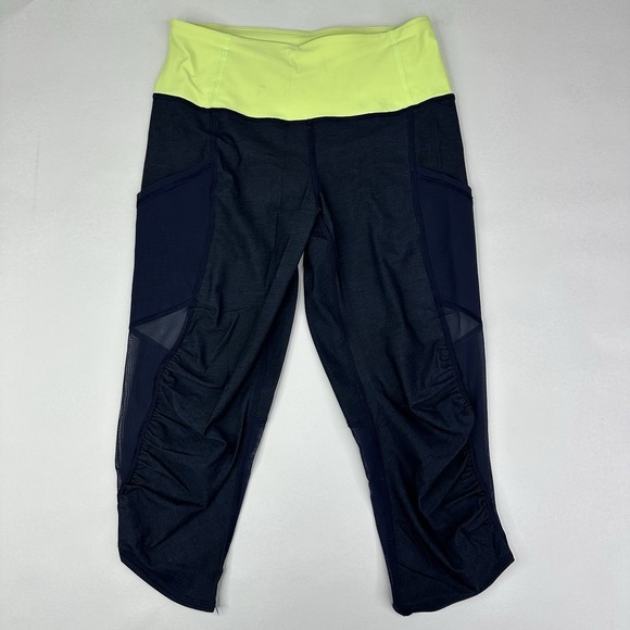 lululemon athletica Pants - Lululemon Athletica Navy Neon Green Mesh Pocket Cropped Leggings Size‎ 4